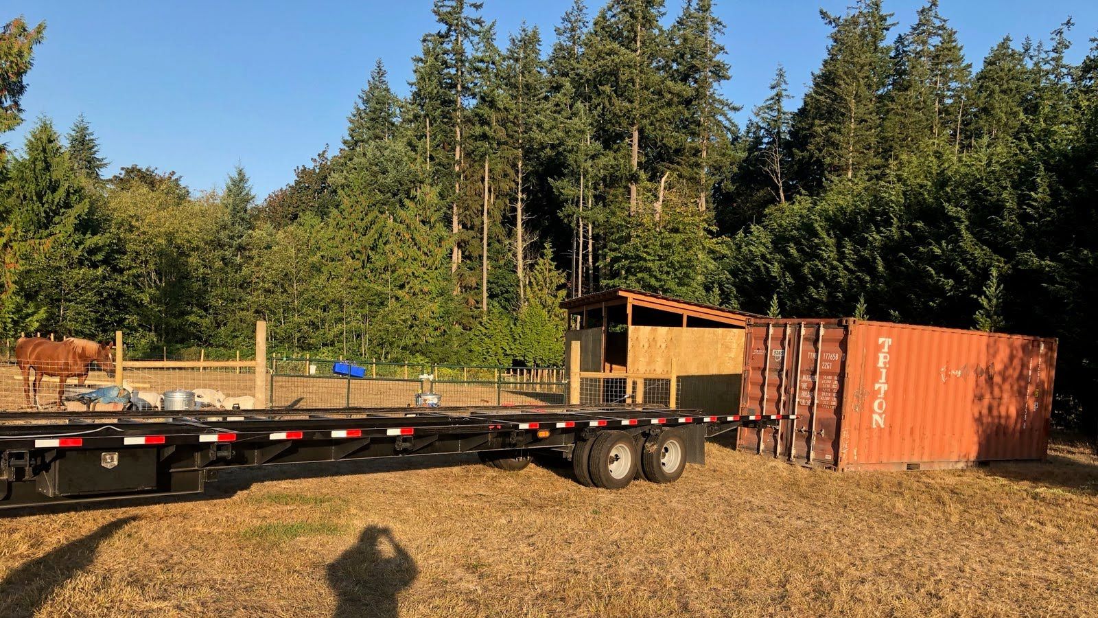 container delivered down a gravel drive to a Grain Valley MO acreage