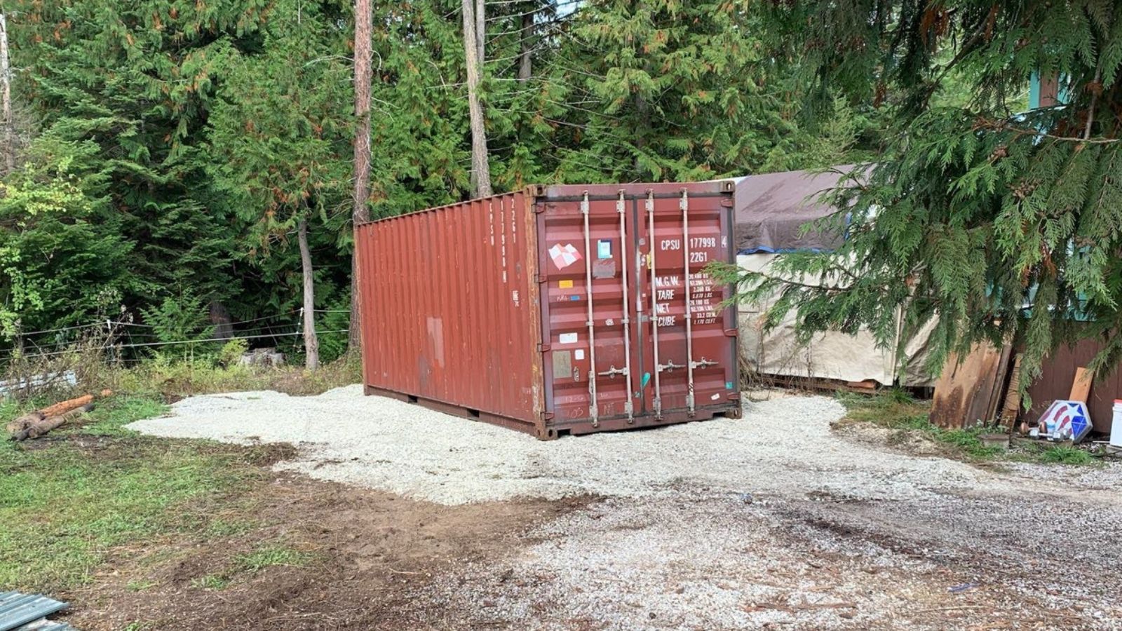 20ft container on a tidy gravel pad behind a Gladstone MO ranch home