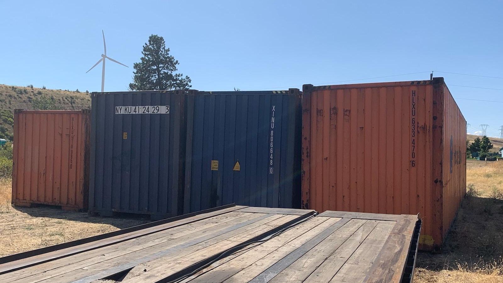 used conex boxes in a Kansas area container yard showing honest cosmetic wear